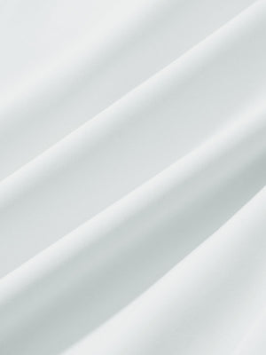 Close-up texture of white women's lightweight athletic sweatpants fabric showing weave detail.