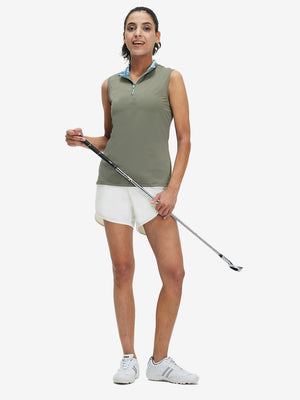 Front full body shot of model wearing white women's high waist 2 in 1 quick dry shorts with 7 pockets