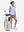Front full body shot of model wearing lavender pink women's high waist 2 in 1 quick dry shorts with 7 pockets