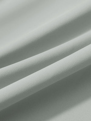Close-up texture of silver gray women's lightweight athletic sweatpants fabric showing weave detail.