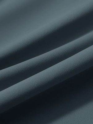 Close-up texture of grey blue women's lightweight athletic sweatpants fabric showing weave detail.