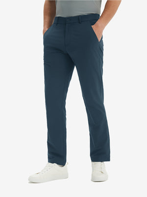Front lower-body view of model in navy stretch quick dry casual golf pants with 4 pockets