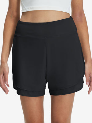 Front lower body shot of model wearing black women's gym golf shorts with liner pocket