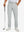 Lightweight moisture wicking dress pants in silver grey, front lower-body with model leaning on golf club.