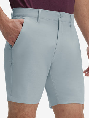 Front lower body shot of model wearing newport blue flat front hybrid golf shorts