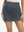 Front lower body shot of model wearing dark grey high waist built-in short a-line golf skirt with 5 pockets