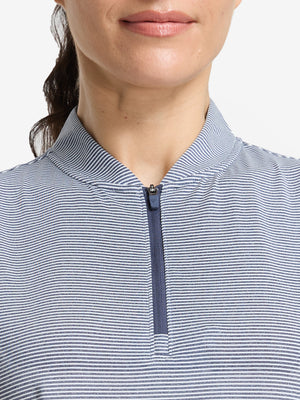 Front shot from nose to chest of model wearing navy white women's q-zip pin striped texture golf shirts