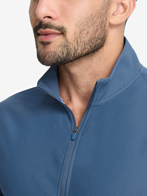 Front view from nose to chest of model wearing slate blue waffle texture 1/4 zip pullover