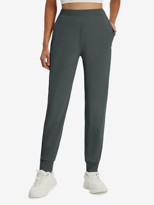 Front lower body shot of model wearing dark grey women's lightweight athletic sweatpants