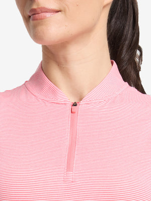 Front shot from nose to chest of model wearing pink coral white women's q-zip pin striped texture golf shirts