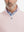Close-up from nose to chest, showing collar and zipper detail of the light pink golf pullover.