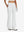 Front lower body shot of model wearing white women's high waist stretch golf pants with pockets