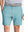 Front view of youth wearing blue light Heather Performance Golf Shorts, showing fit and style