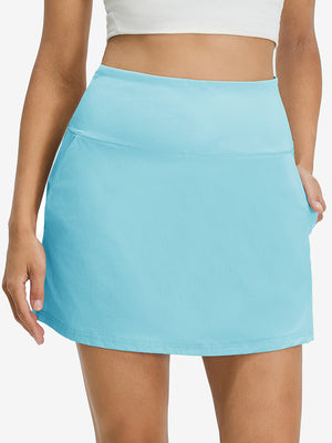 Front lower body shot of model wearing lake green women's stretch a-line golf skort with 7 pockets
