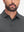 Front view from nose to chest of model wearing light and dark grey comfy breathable pin-stripe texture golf polos