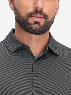 Front view from nose to chest of model wearing light and dark grey comfy breathable pin-stripe texture golf polos