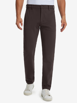 Model wearing Golf Lightweight Fleece Lined Dress Pants in coffee brown, lower body front view