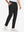 Front lower body shot of model wearing black stretch cotton blend slim fit golf trousers 5 pockets
