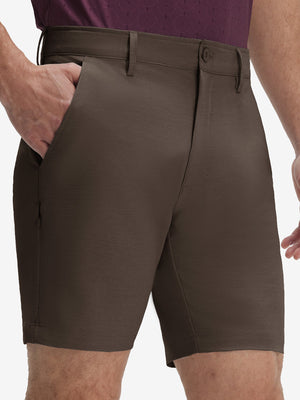 Front lower body shot of model wearing tobacco brown flat front hybrid golf shorts
