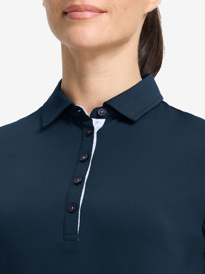 Front shot from nose to chest of model wearing navy women's 5 buttons collared polo shirts