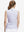 Back upper body shot of model wearing pink purple rose women's sleeveless v-neck print golf shirts