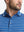 Front shot from nose to chest of model wearing classic blue/airy blue non-curl ribbed collar striped polo shirts