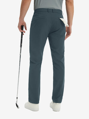 Rear lower-body: model in grey blue stretch quick dry casual golf pants with 4 pockets holding golf club in right hand.