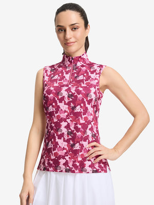 Front upper body shot of model wearing red splatter women's sleeveless q-zip print quick dry golf tops