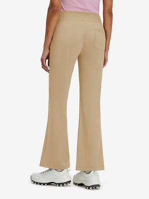 Back lower body shot of model wearing light khaki women's high waist stretch golf pants with pockets