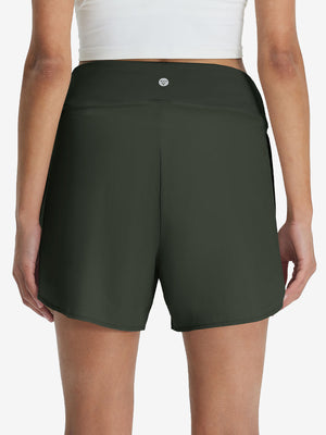 Back lower body shot of model wearing army green women's gym golf shorts with liner pocket