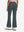 Back lower body shot of model wearing dark grey women's high waist stretch golf pants with pockets
