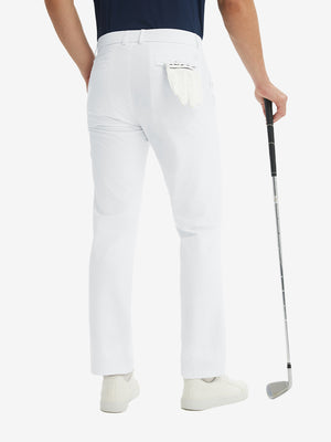 Rear lower-body: model in white stretch quick dry casual golf pants with 4 pockets holding golf club in right hand.