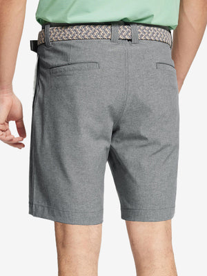 Back view of youth in light grey Heather Performance Golf Shorts, highlighting rear design and fit