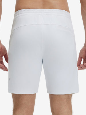 Back lower body shot of model wearing white 4 way stretch breathable workout athletic shorts