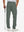 Back lower-body view of lightweight moisture wicking dress pants, model with golf club in slate green.