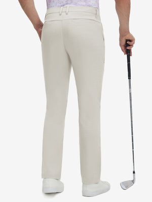 Back lower body shot of model wearing fossil straight fit lightweight dress golf pants