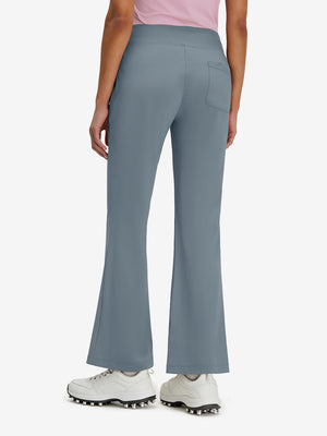 Back lower body shot of model wearing grey blue women's high waist stretch golf pants with pockets