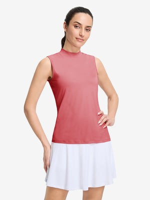 Front upper body shot of model wearing pink women's moisture-wicking mock neck sleeveless golf tops