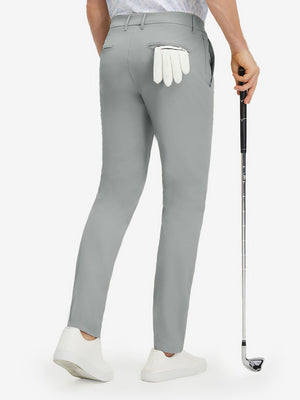 Back lower body shot of model wearing rose dust stretch cotton blend slim fit golf trousers 5 pockets