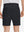 Back lower body shot of model wearing black flat front flex cotton blend golf shorts