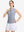 Front upper body shot of model wearing navy white women's q-zip pin striped texture golf shirts