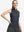 Front upper body shot of model wearing black gray blocks women's sleeveless q-zip print quick dry golf tops
