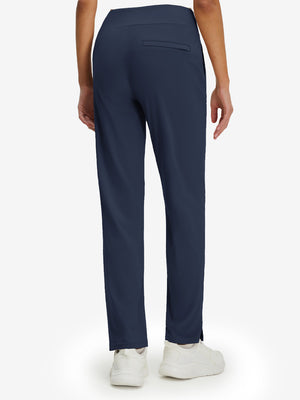 Back lower body view of model wearing the navy women's lightweight high waisted golf pants, highlighting the rear design