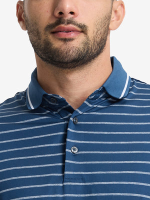 Front shot from nose to chest of model wearing navy peony/arctic white non-curl ribbed collar striped polo shirts