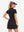 Back upper body view in black of women's lightweight golf dress with 2 pockets.