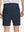 Back lower body shot of model wearing navy flat front flex cotton blend golf shorts