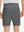 Back lower body shot of model wearing dark grey flat front flex cotton blend golf shorts