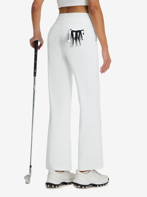 Back lower body shot of model wearing white women's high waist stretch golf pants with pockets