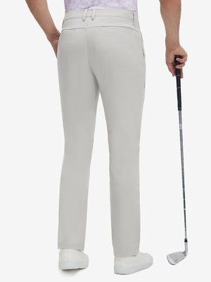 Back lower body shot of model wearing light gray straight fit lightweight dress golf pants