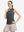 Front upper body shot of model wearing light and dark grey women's q-zip pin striped texture golf shirts